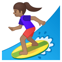 Woman surfing medium skin tone icon
